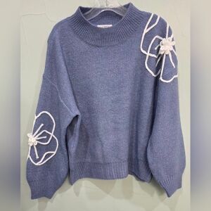 Blue Sweater with White Flower Stitch Detailing